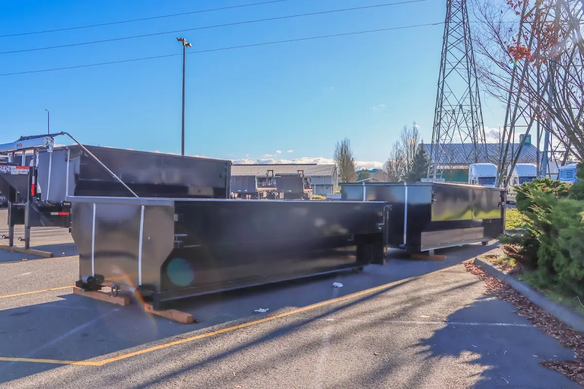 Roll-off dumpster ready for waste disposal at job site for Concrete Dumpster Rental in Pinson